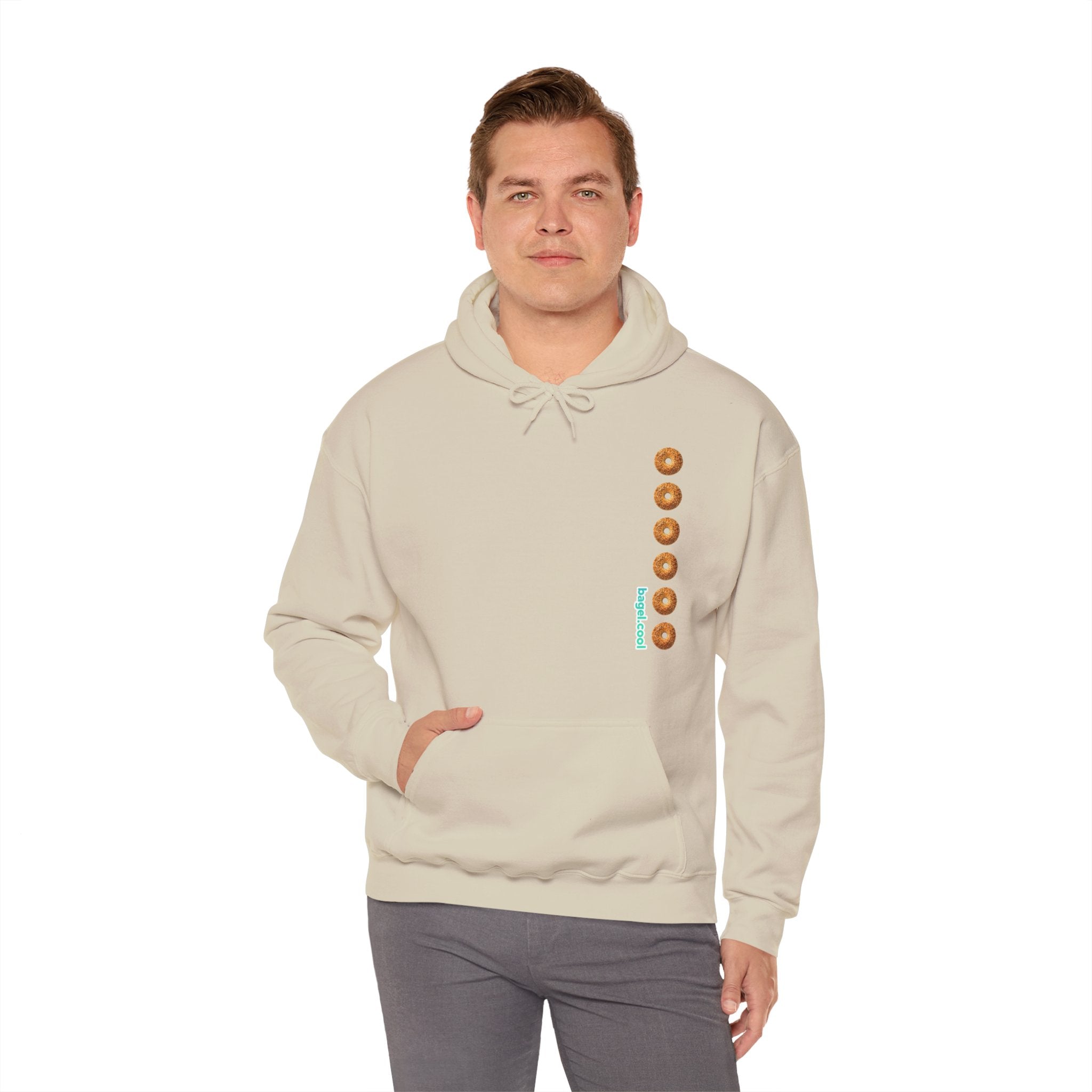 A man wearing a Sand hoodie with a stripe made of bagels on the right